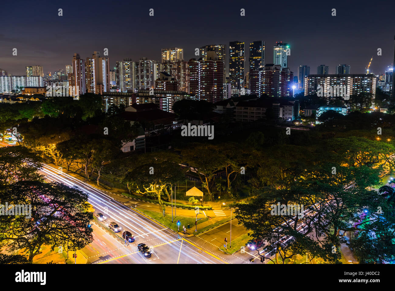 View of the Downtown Singapore skyline, night scene long exposure with traffic and car trails Stock Photo