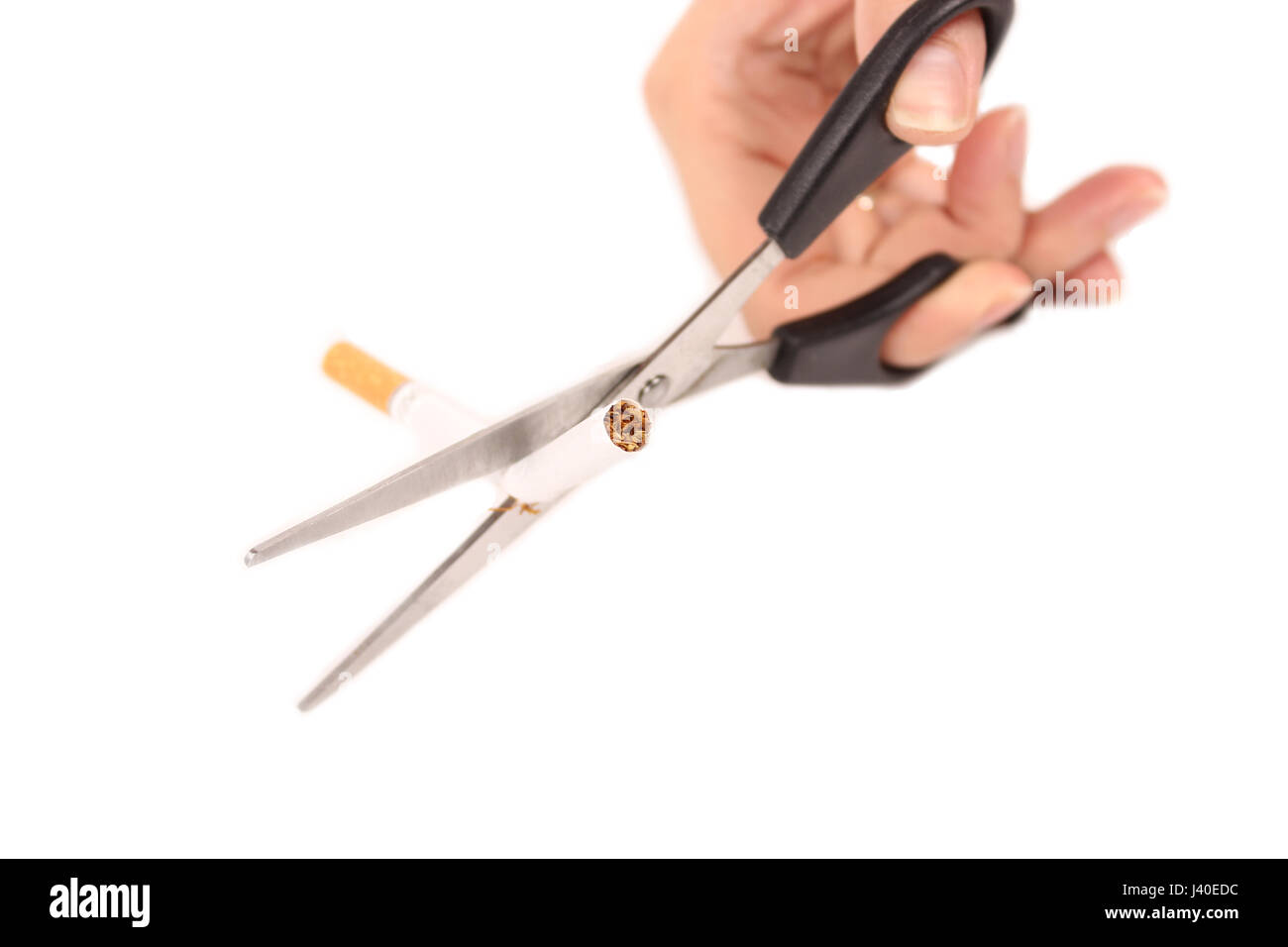 Cutting the cigarette in half Stock Photo Alamy