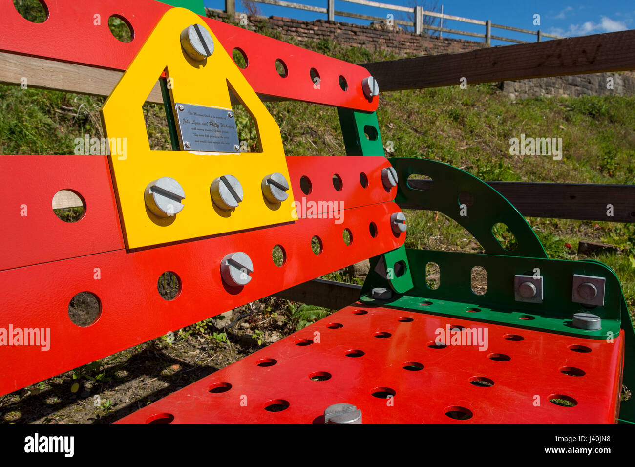 Bench seat made from scaled up Meccano parts, at the Meccano Bridge, Manchester Bolton & Bury Canal, Little Lever, Bolton, Manchester, England, UK Stock Photo