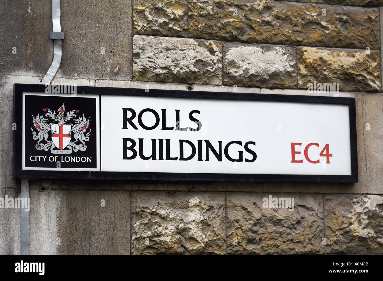 Rolls Buildings road street sign in the City of London EC4. Home to The Rolls Building Royal Courts of Justice. Coat of arms and crest Stock Photo