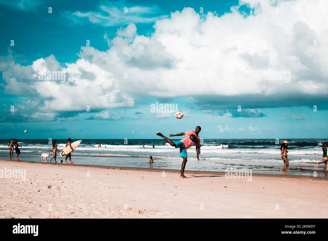 youth playing soccer and fottball on Tiririca beach, Itacare, Bahia, Brazil Stock Photo