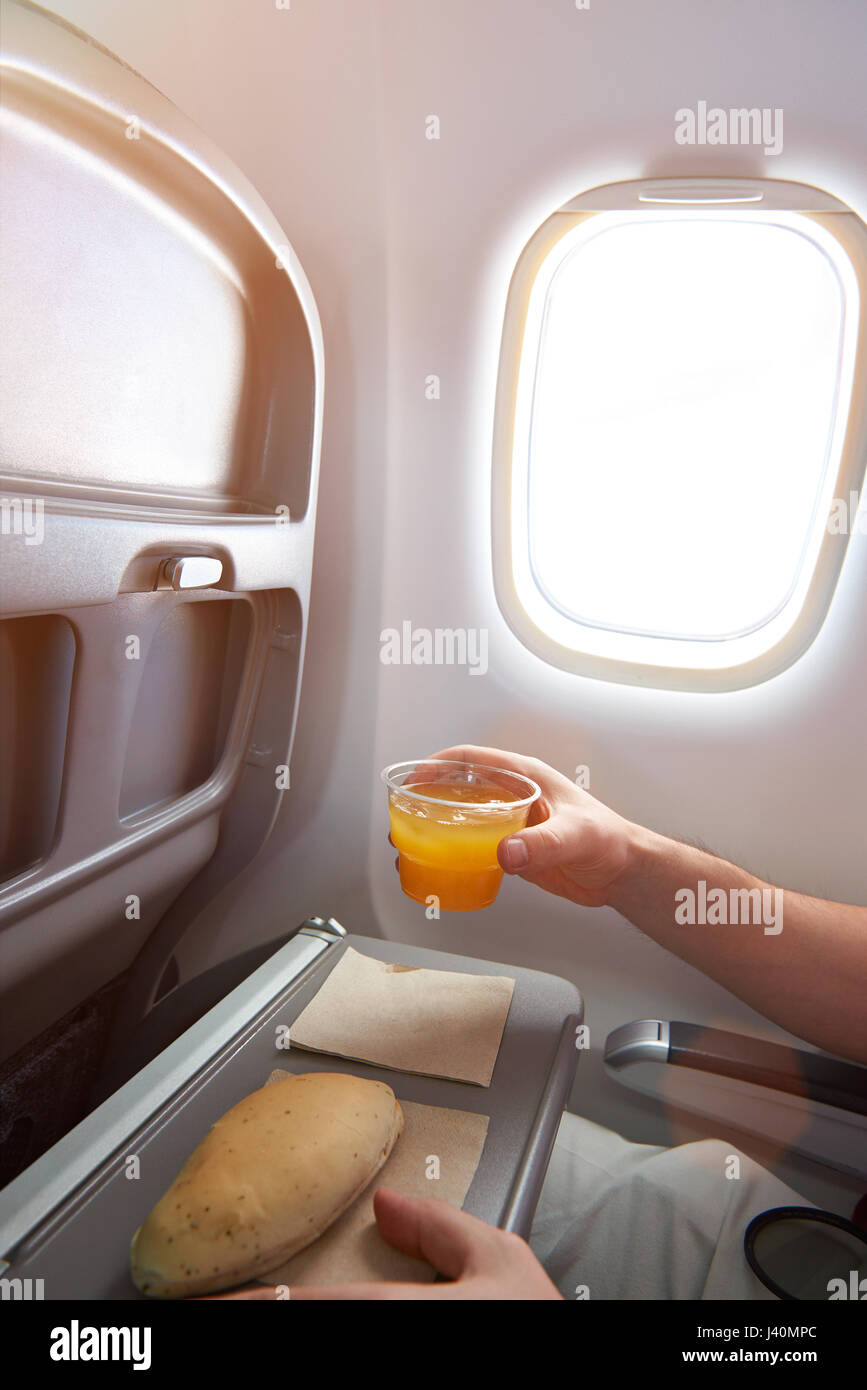 Airplane passenger meal of orange juice and sandwich Stock Photo
