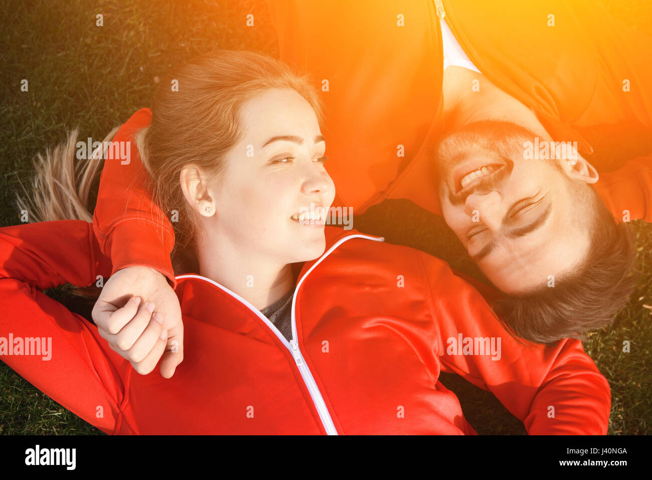 Sport man and woman resting in park Stock Photo