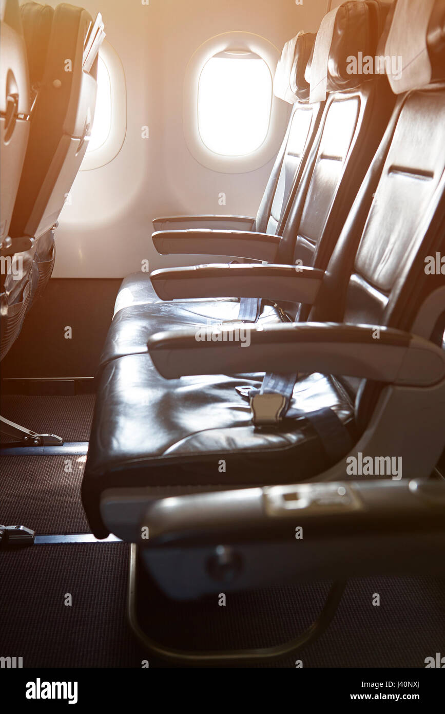 One row of leather seats in modern airplane. Clean leather air plane chairs Stock Photo Alamy