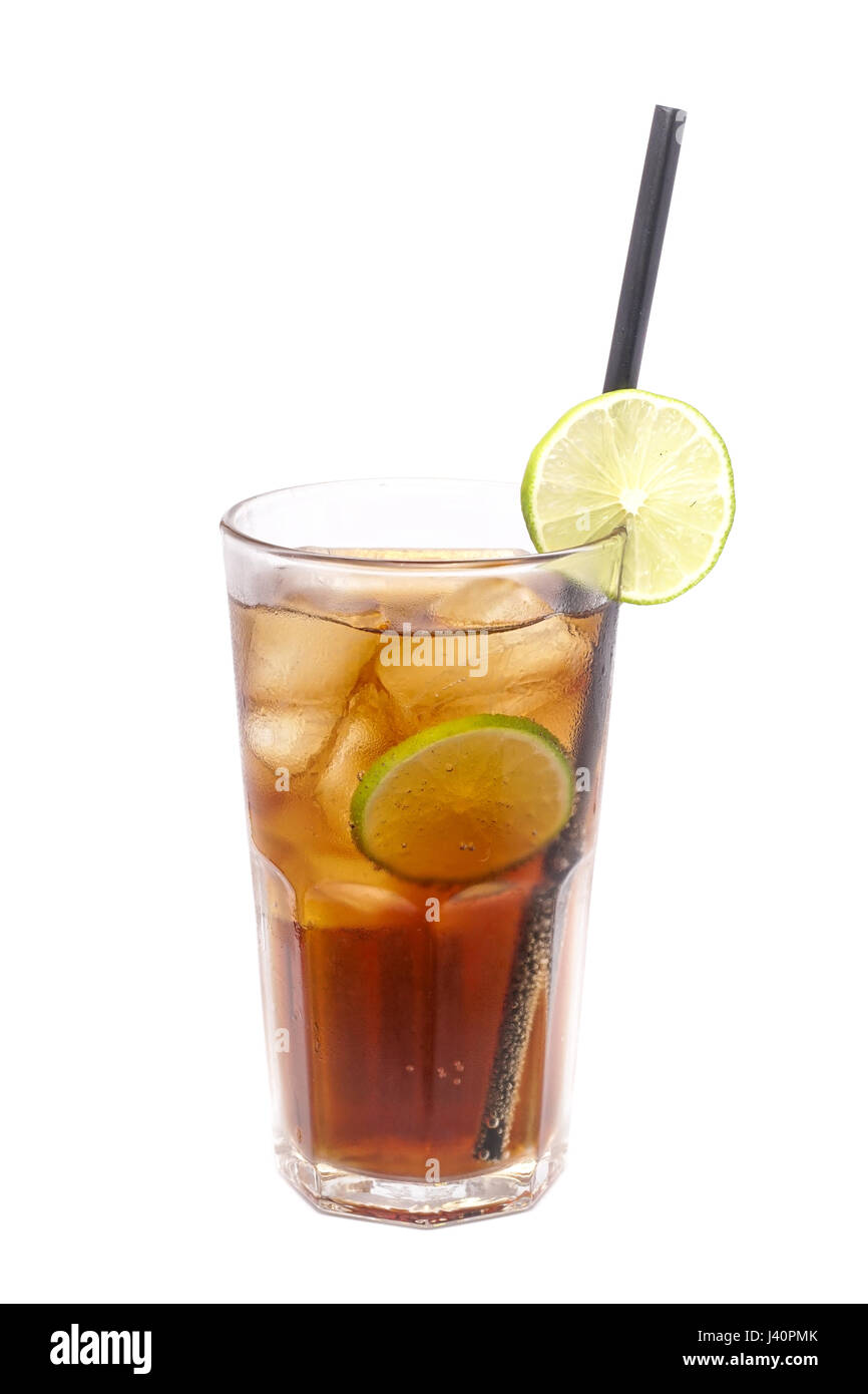 Close up of glass with alcohol cocktail with lime, vodka and cola isolated on a white background. Stock Photo