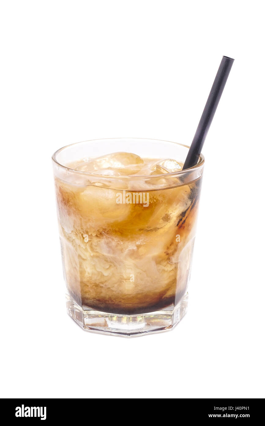 Close up of glass with alcohol russian cocktail with rum, cola and white creamy milk isolated on a white background. Stock Photo