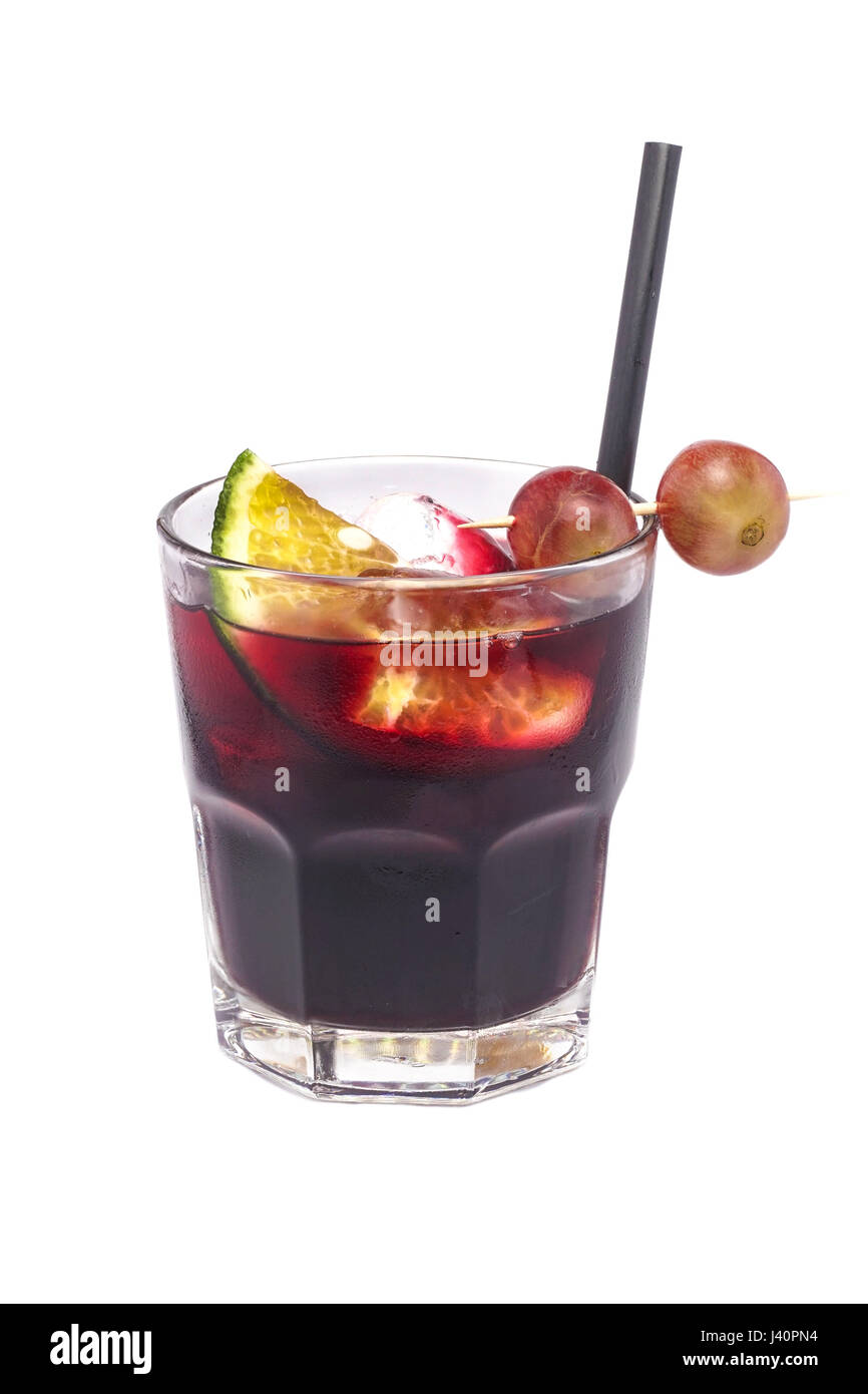 Close up of glass with alcohol cocktail with cola, orange and grapefruit isolated on a white background. Stock Photo