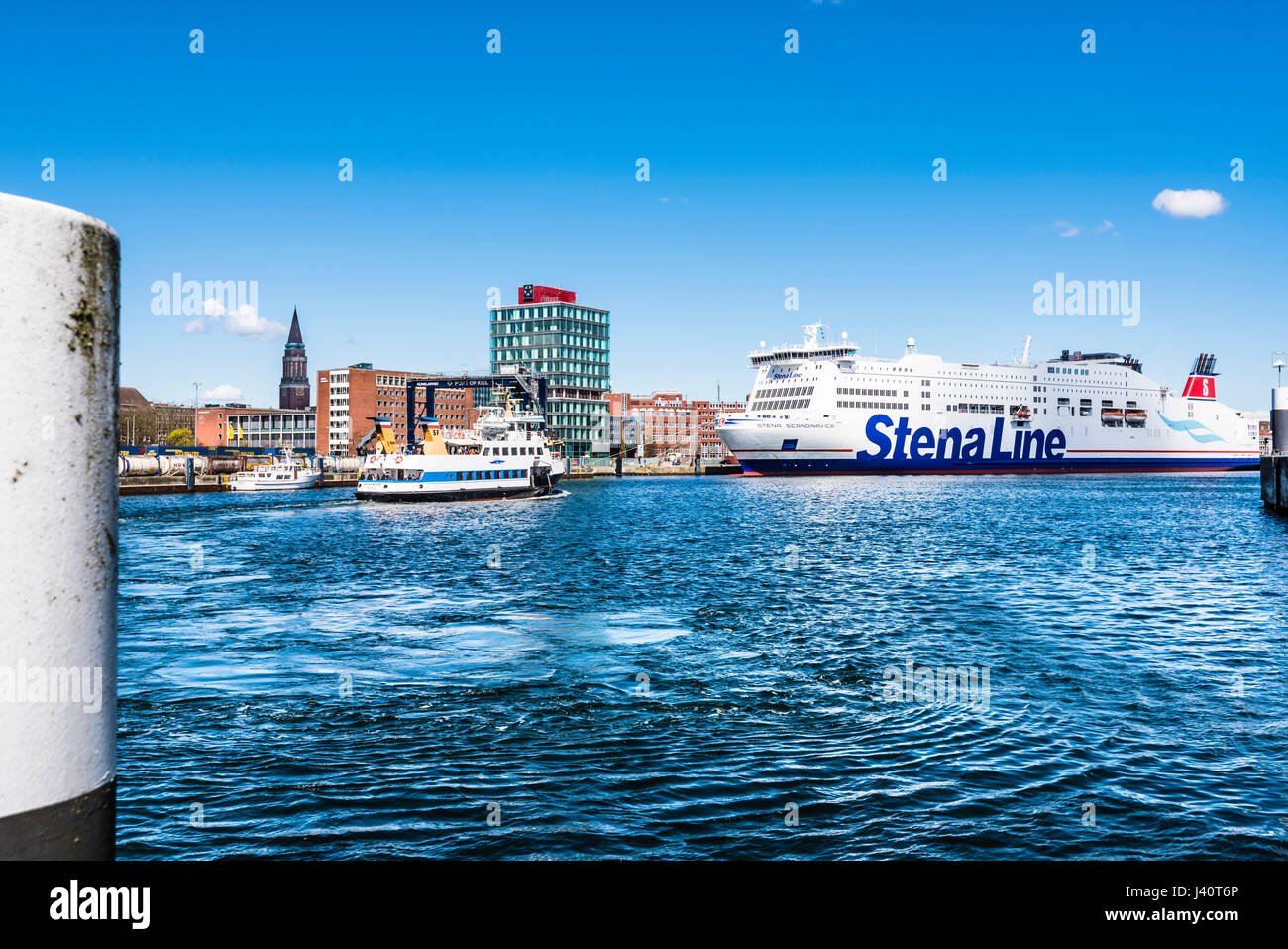 The ferry to Sweden and the passenger ferry on the Kieler Förde in the harbour with the city hall tower, Kiel, Schleswig Holstein, Germany Stock Photo