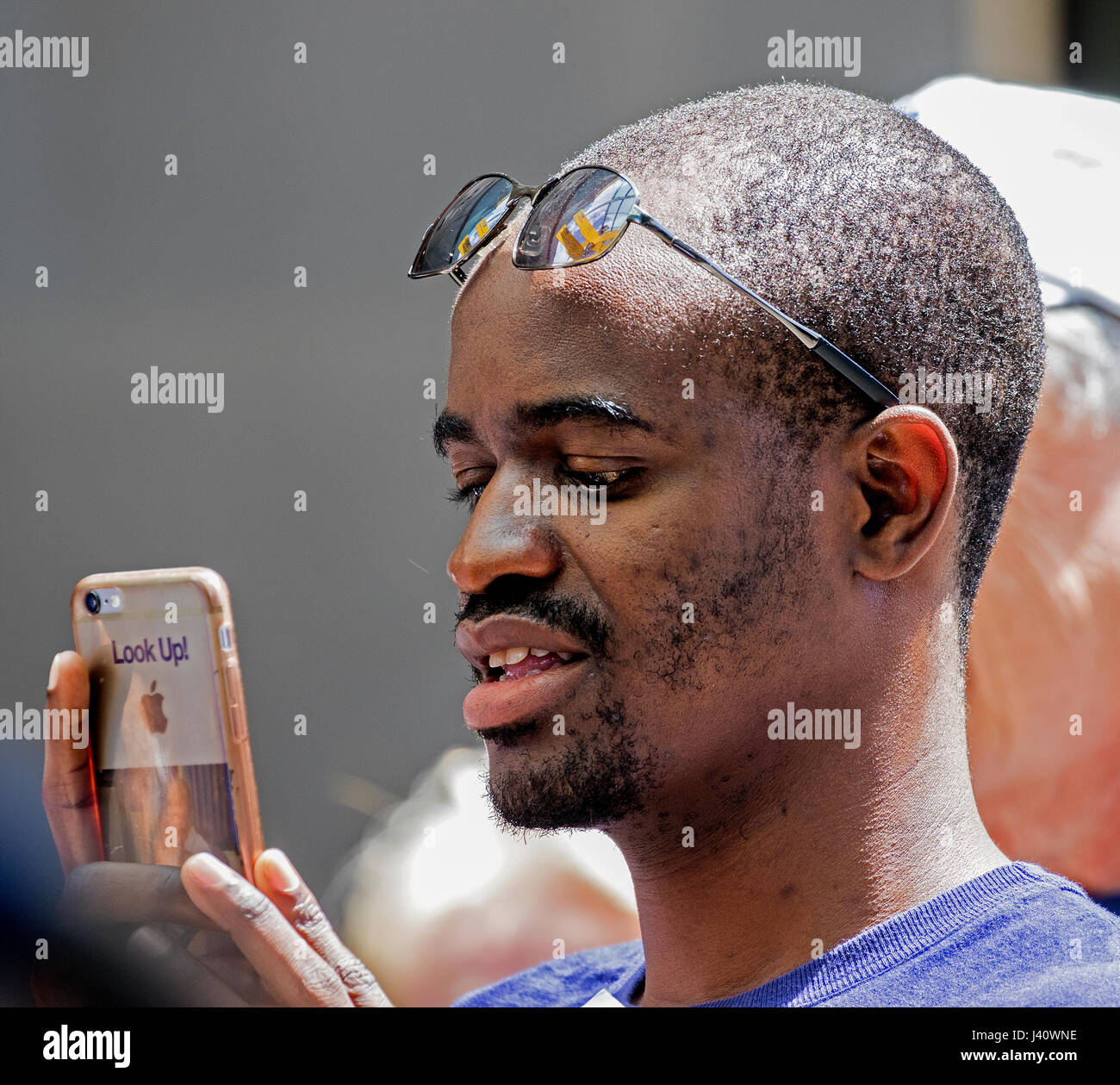 afro american man looking at mobile phone Stock Photo