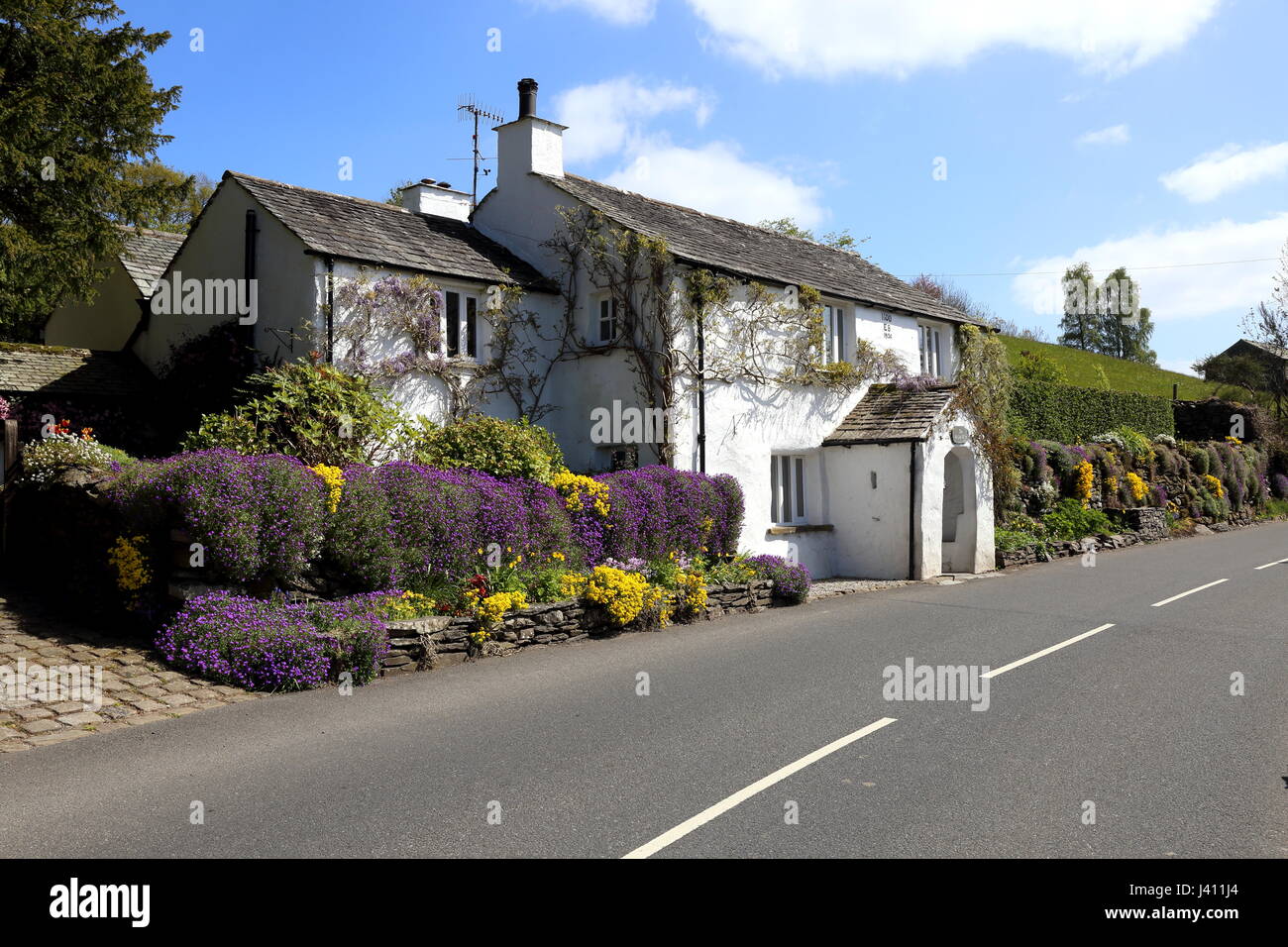 Roadside traditional Cumbrian property, formerly a Post Office, with