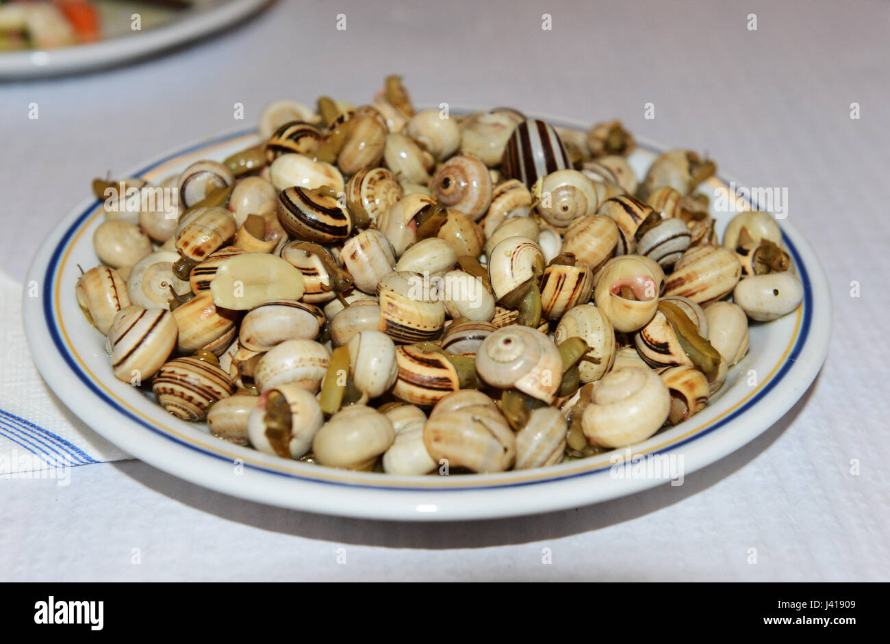 caracois - Portuguese snail dish. Stock Photo