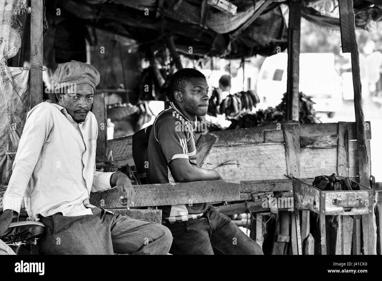 Two men at the market, Kigamboni, Tanzania, Africa Stock Photo