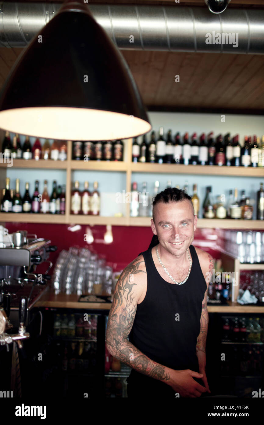 Barkeeper Varis in hip Cabo Cafe, cafe and restaurant at lake Kisezers, Mezaparks, Riga, Latvia Stock Photo