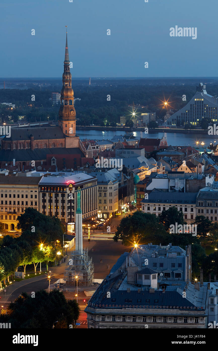 View from Radisson Blue Hotel over the old town at night, liberty monument, St. Petri church, Daugava river, National Library, old town, Riga, Latvia Stock Photo