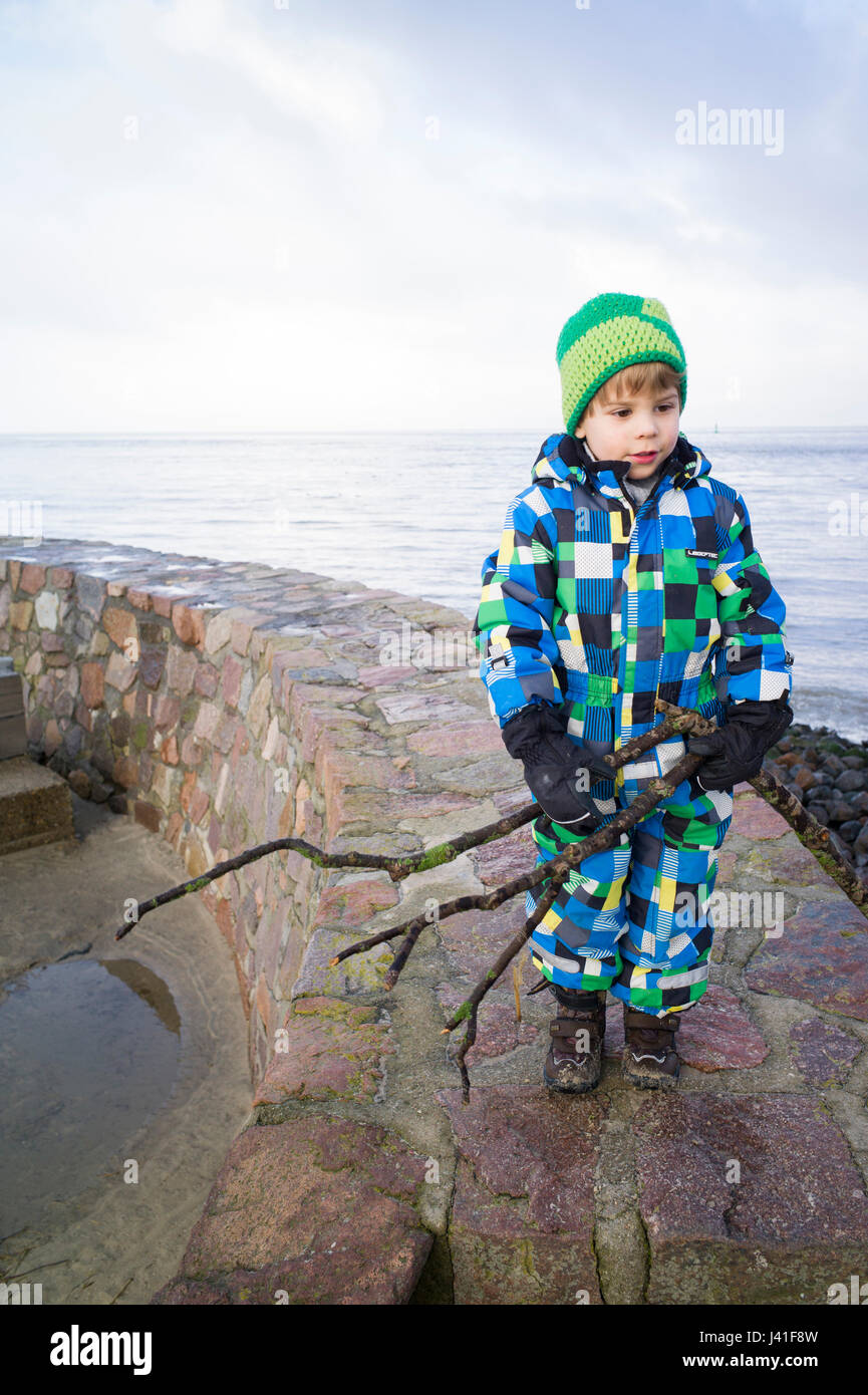 Boy walking at north sea hi-res stock photography and images - Alamy