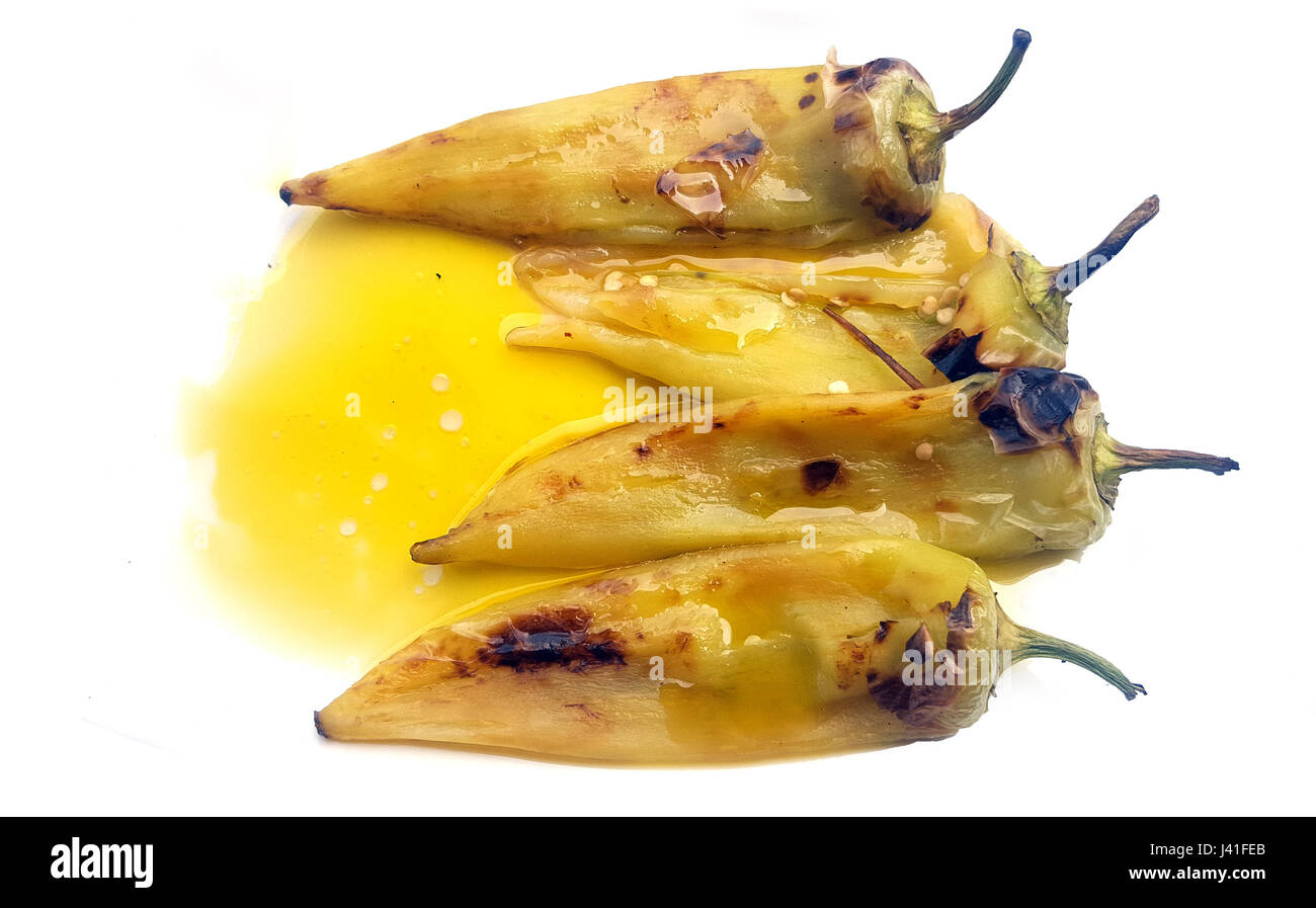 Grilled green sweet peppers with olive oil on white background Stock ...