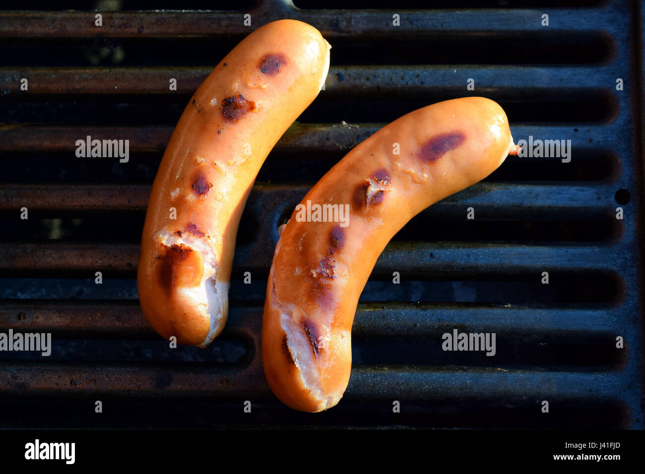 High angle view of two sausages on barbeque grill Stock Photo