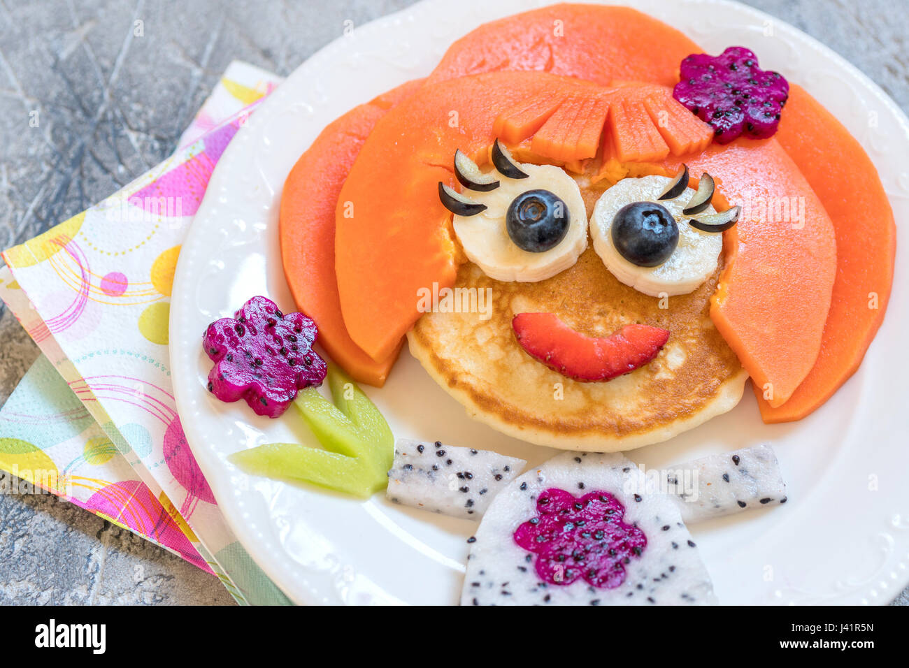 Funny girl pancake face with fruits and berries Stock Photo Alamy