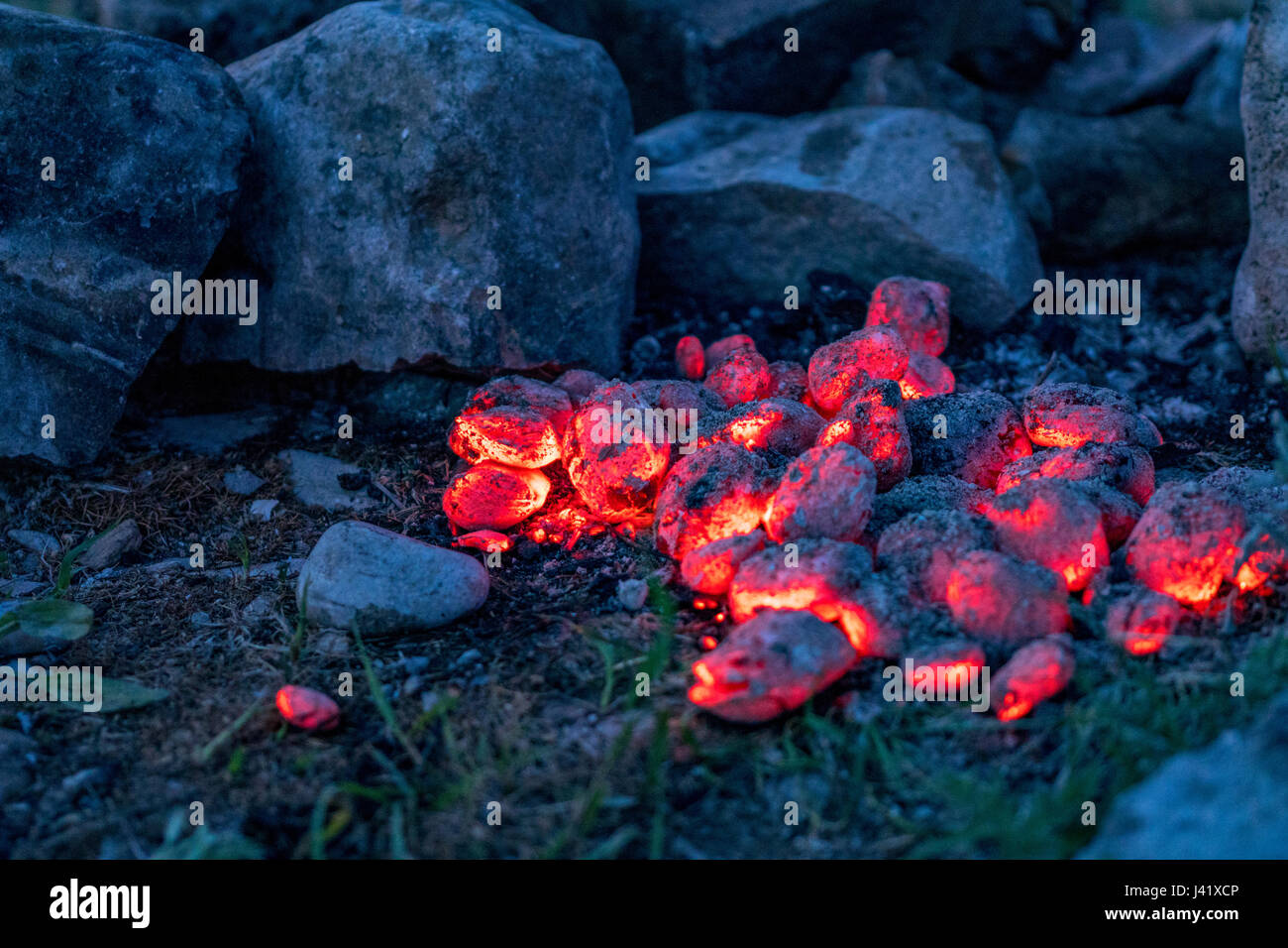 BBQ Grill Pit With Glowing And Flaming Hot Charcoal Briquettes Stock Photo