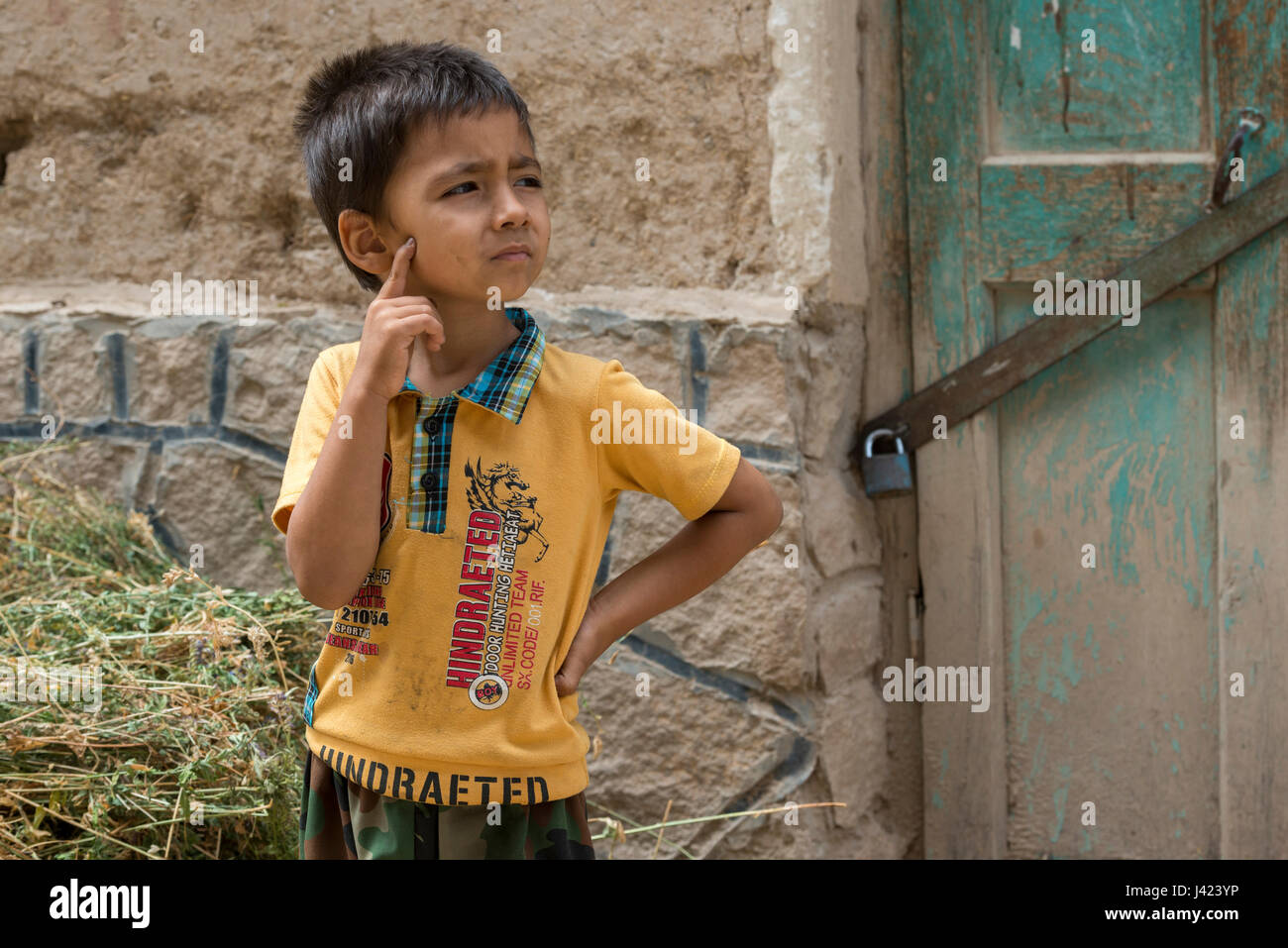 Bewildered Boy, Esfidan, A Traditional Rural Village, North Khorasan Province, IRAN Stock Photo