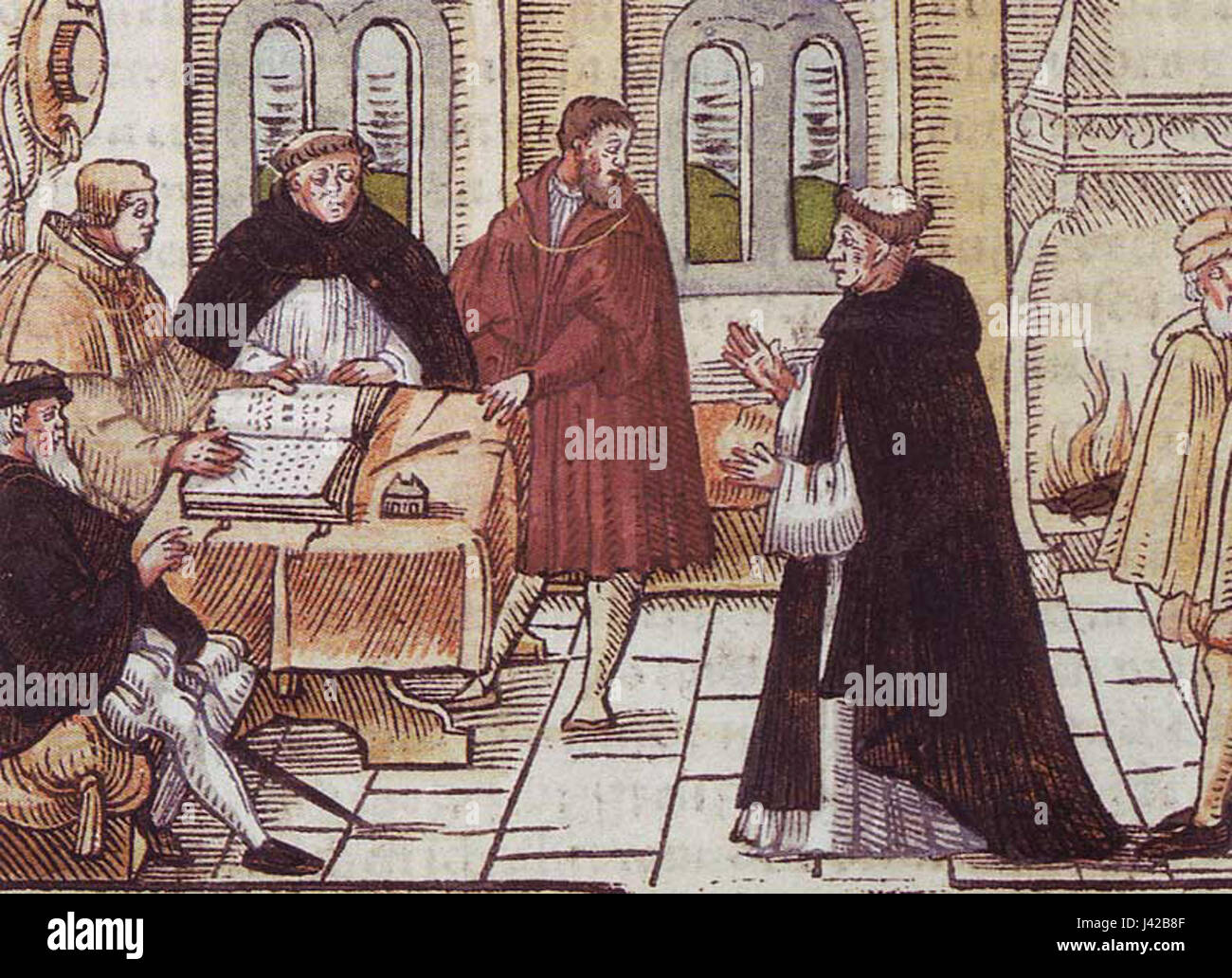 This image depicts Martin Luther standing before Cardinal Cajetan, an important event in the early stages of the Protestant Reformation. The encounter took place in 1518 in Augsburg, where Luther was summoned to defend his views on church practices. Stock Photo