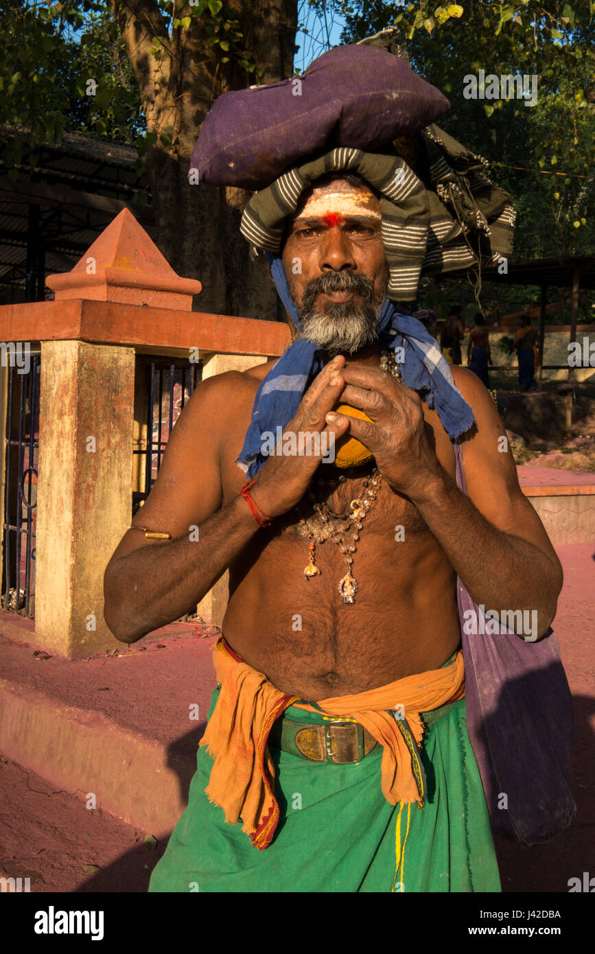 Sabarimala Devotee Carrying Pilgrimage Clothes On His Head, Erumely, Kerala, INDIA - 25/12/2015. Sabarimala is a Hindu pilgrimage destination located  Stock Photo