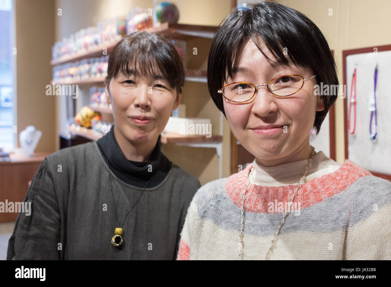 Kanazawa, Japan - March 30th, 2017: Portrait of two japanese woman working in a Kaga Yubinuki traditional store where they make the traditional thimble Stock Photo