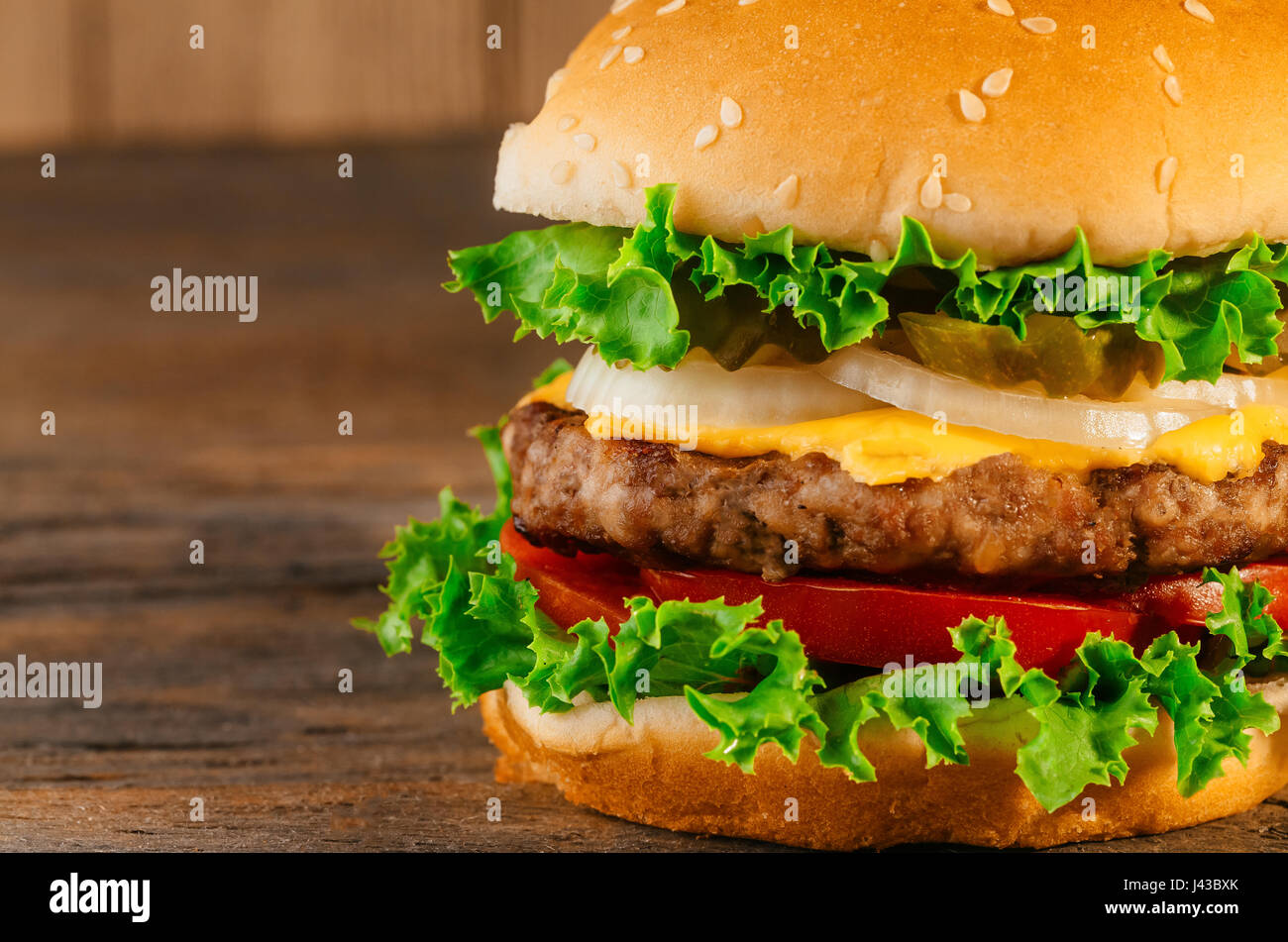 Homemade hamburger with fresh vegetables Classic deluxe cheeseburger Stock Photo