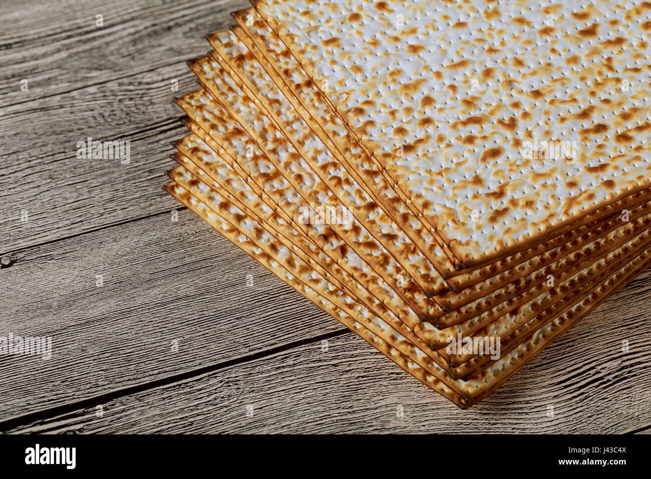 traditional Jewish kosher matzo for Passover macro on a wooden table