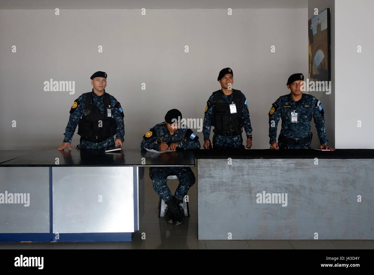 Members of the security force stand guard in Mundo Maya International Airport in the city of Flores Guatemala Stock Photo