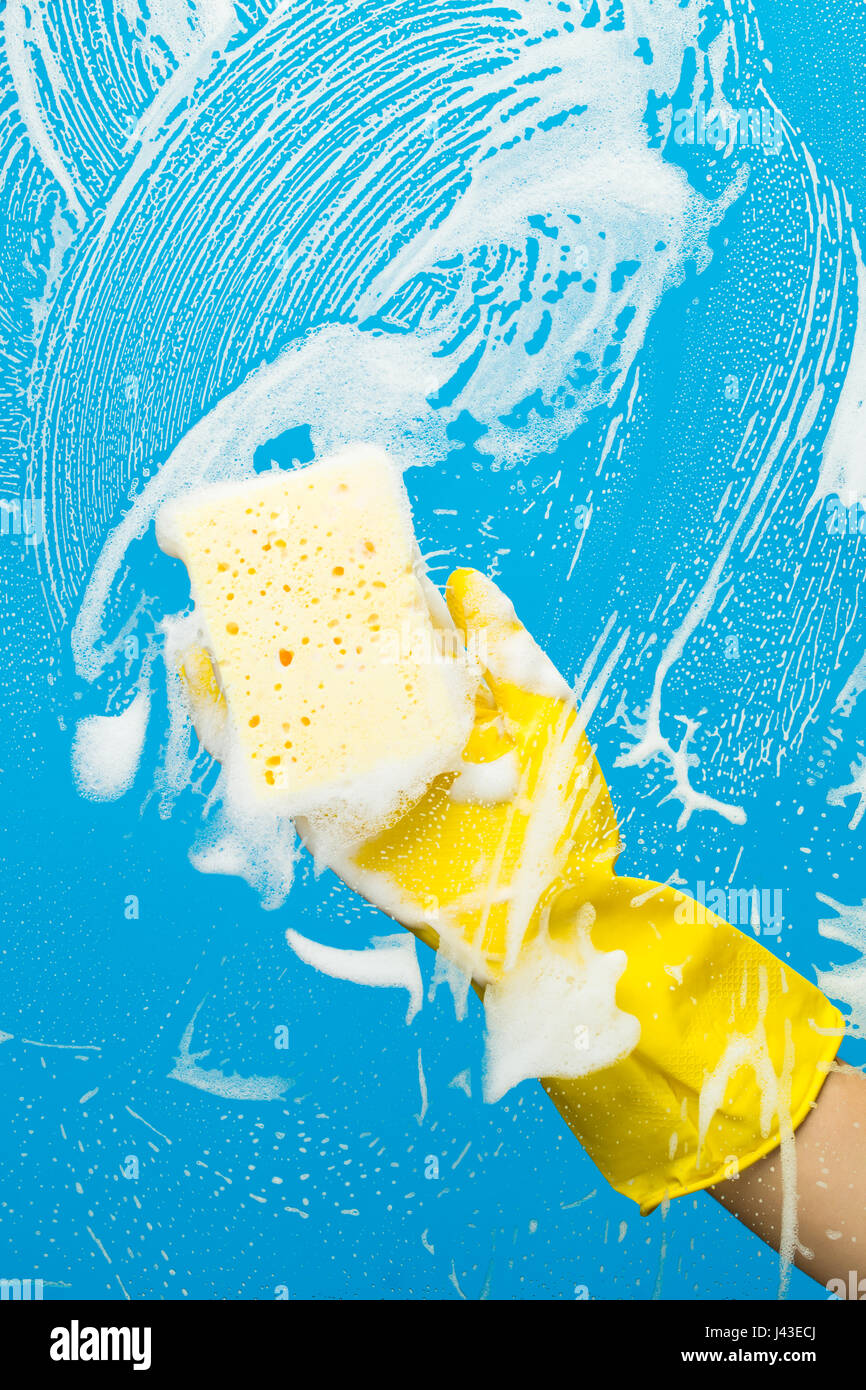 Worker with sponge cleaning window Stock Photo Alamy