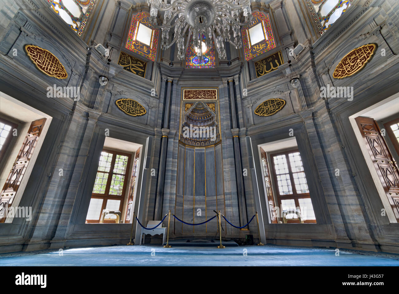 Interior of Nuruosmaniye Mosque showing the Niche (Mihrab), marble wall and stained glass windows, an Ottoman Baroque style mosque completed in 1755,  Stock Photo