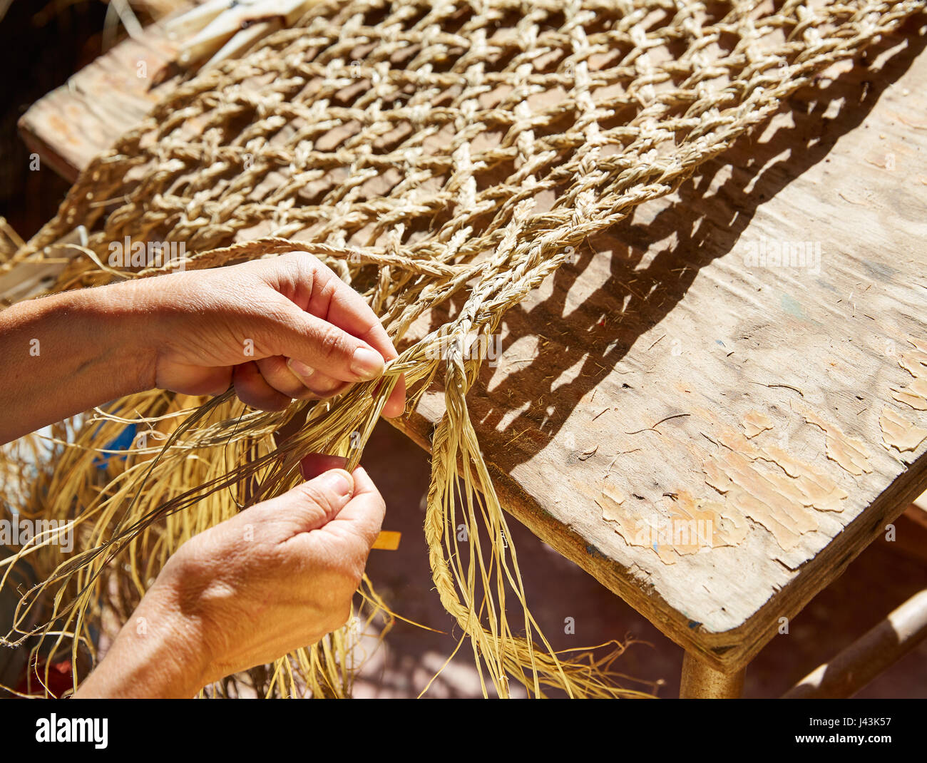 Esparto halfah grass crafts craftsman hands working Stock Photo Alamy