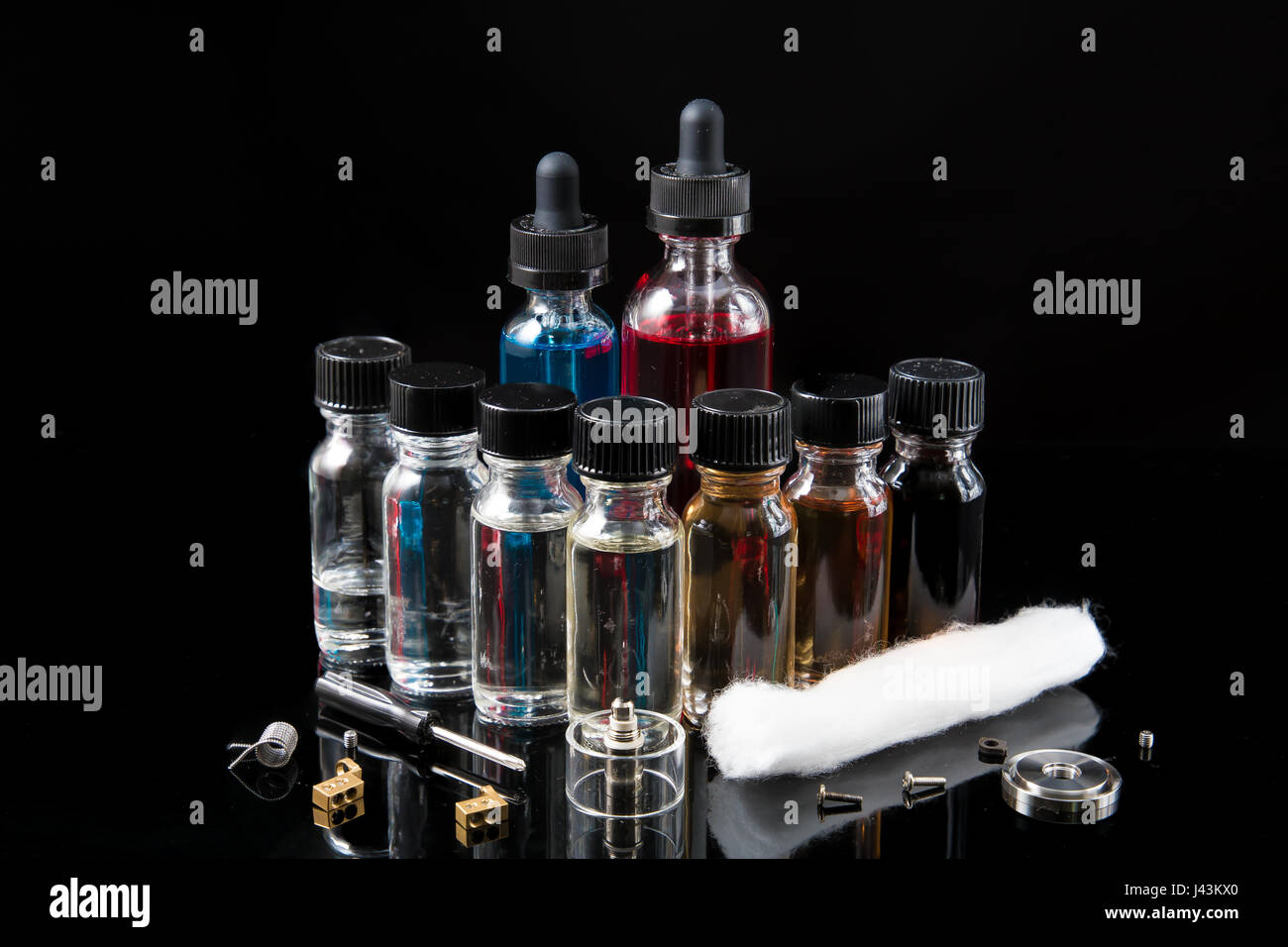 Vaporizer glass e-liquids with tools Stock Photo