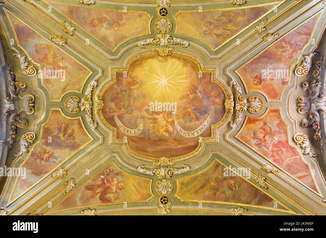 TURIN, ITALY - MARCH 14, 2017: The ceiling fresco of the angels with the marianic inscription of litany in church Chiesa di San Francesco. Stock Photo