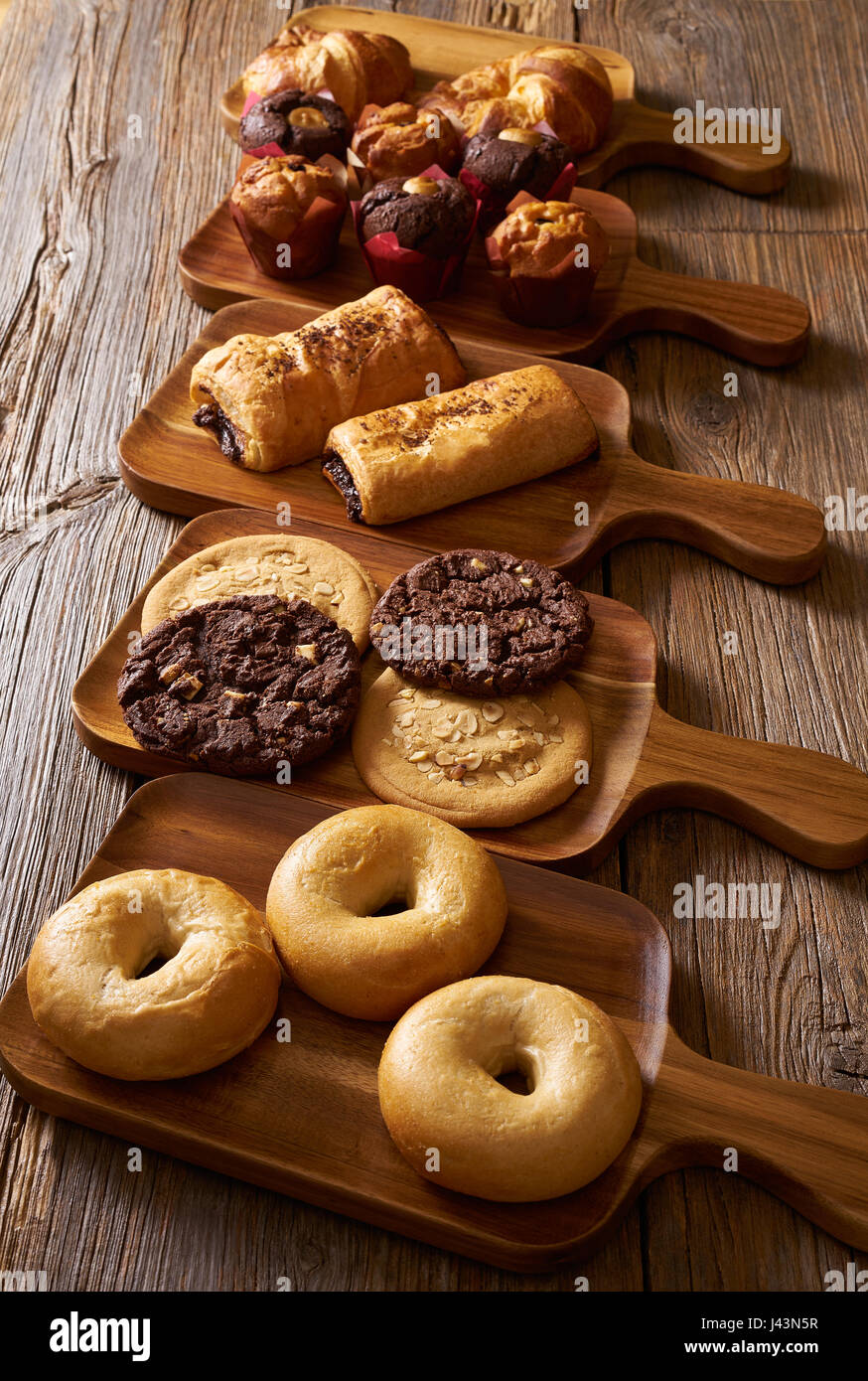 Pastries in a row Croissant Muffin Cookie Bagel and Neapolitan bakery Stock Photo Alamy