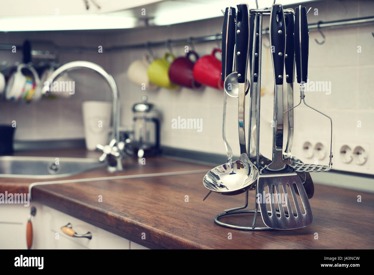 Kitchen utensils on  work top in modern kitchen Stock Photo