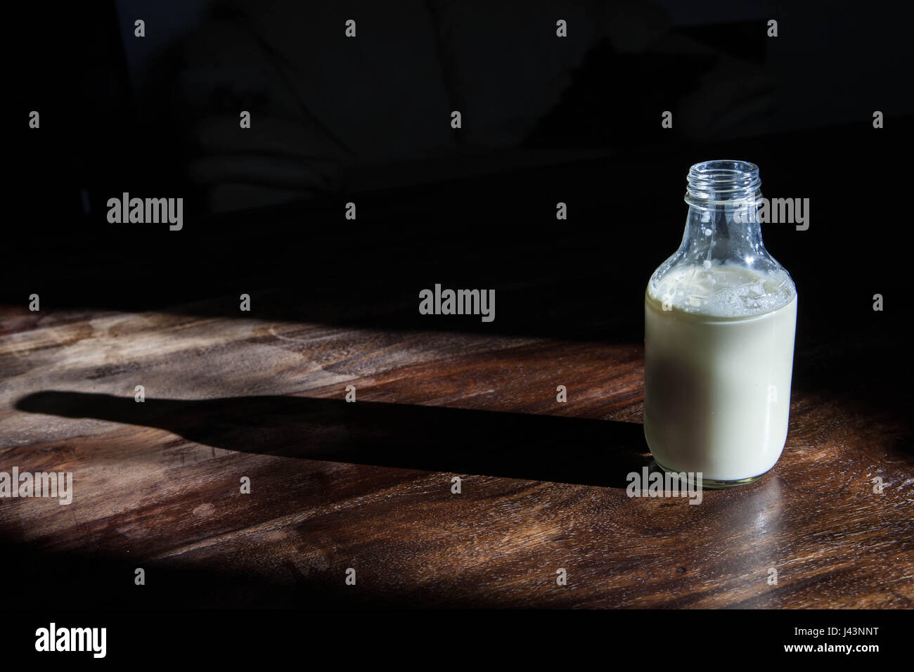 Milk in an old fashioned antique milk bottle Stock Photo