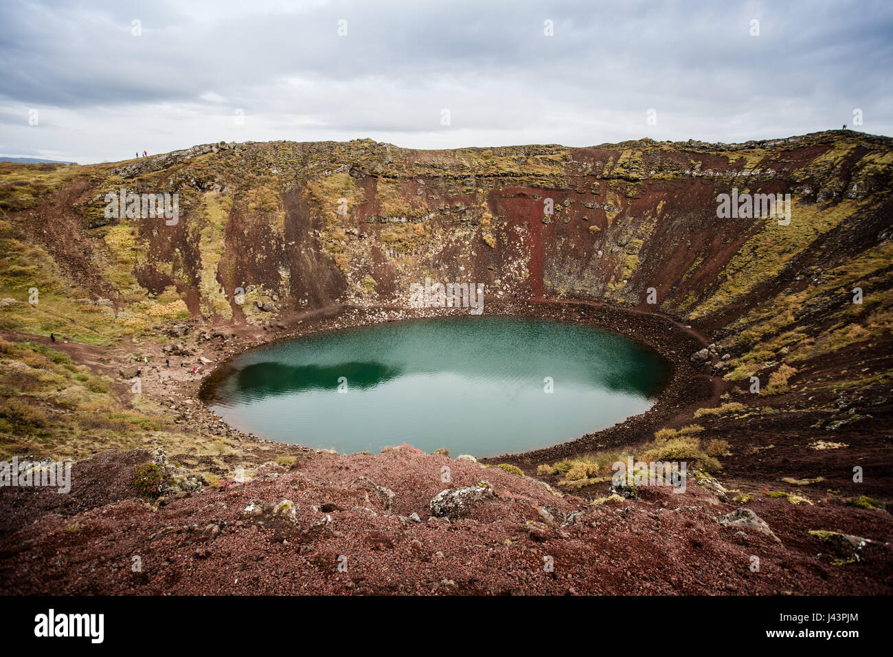 Crater of an volcano. With great mountain range in the background ...