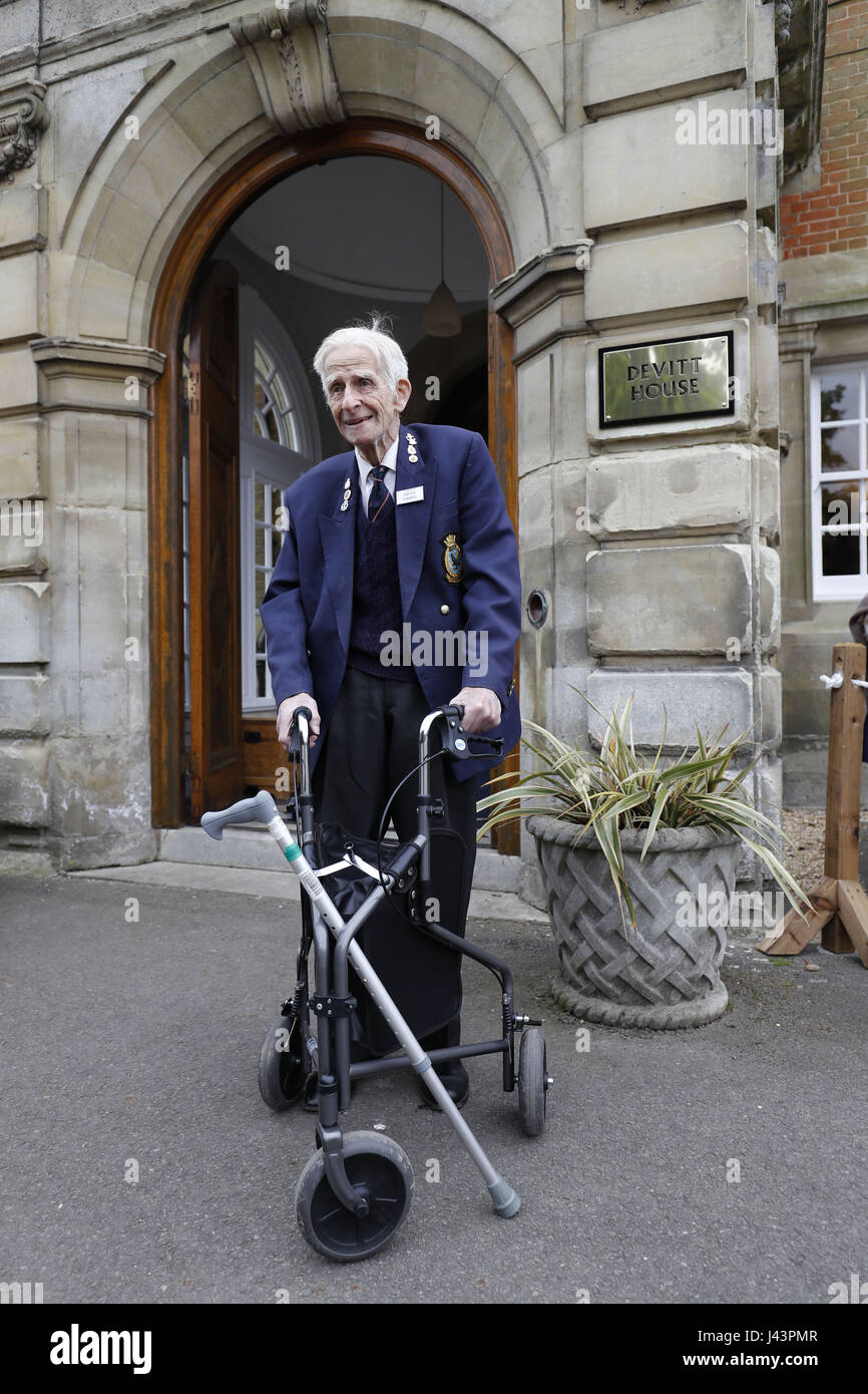 Former naval commander and oldest living college student, Keith Evans waits for the arrival of Queen Elizabeth II and the Duke of Edinburgh for their visit to Pangbourne College in Berkshire to celebrate its centenary. Stock Photo