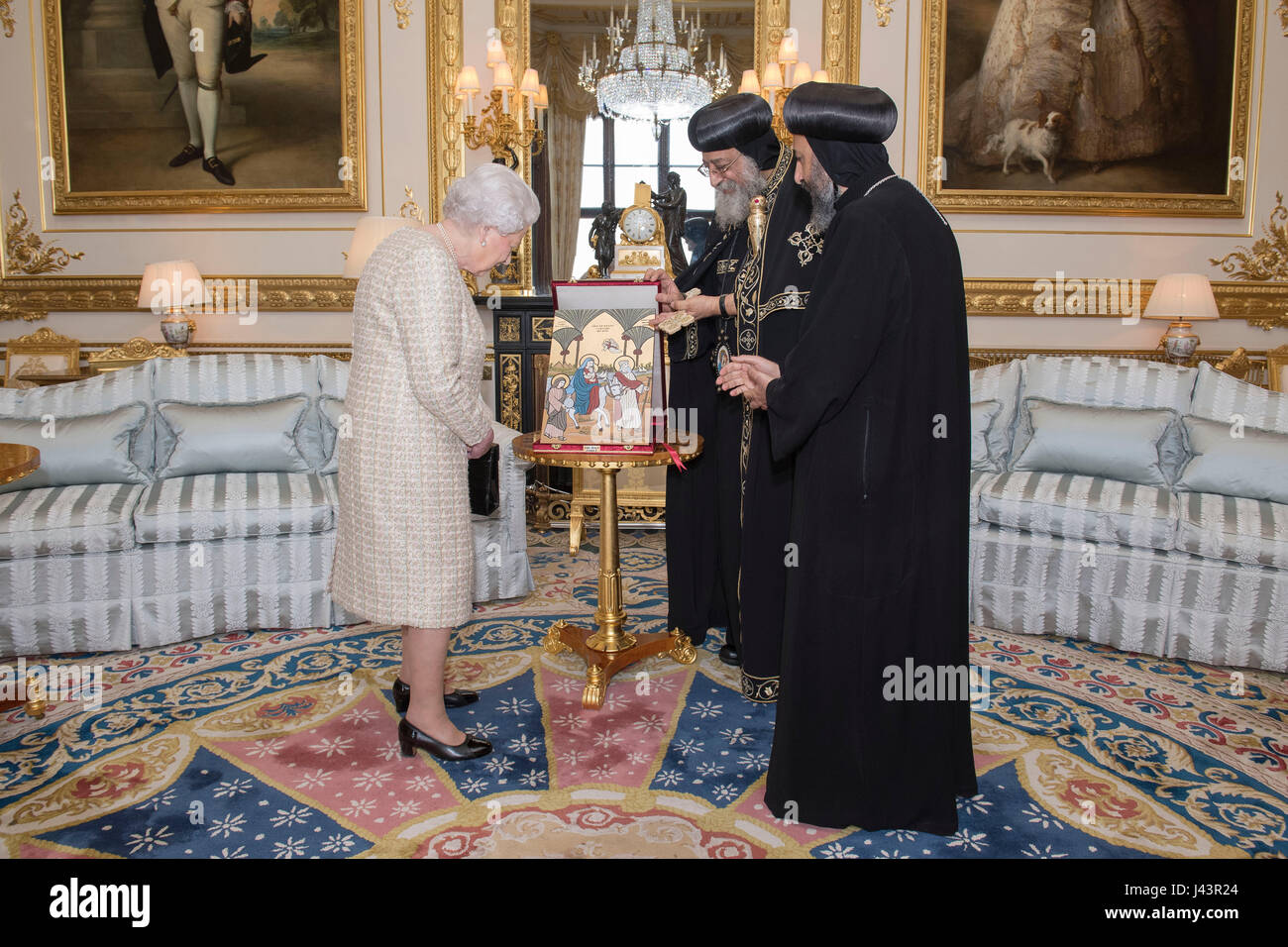 Queen Elizabeth II receives a gift from His Holiness Pope Tawadros II (centre), during a private audience at Windsor Castle, Berkshire. Stock Photo
