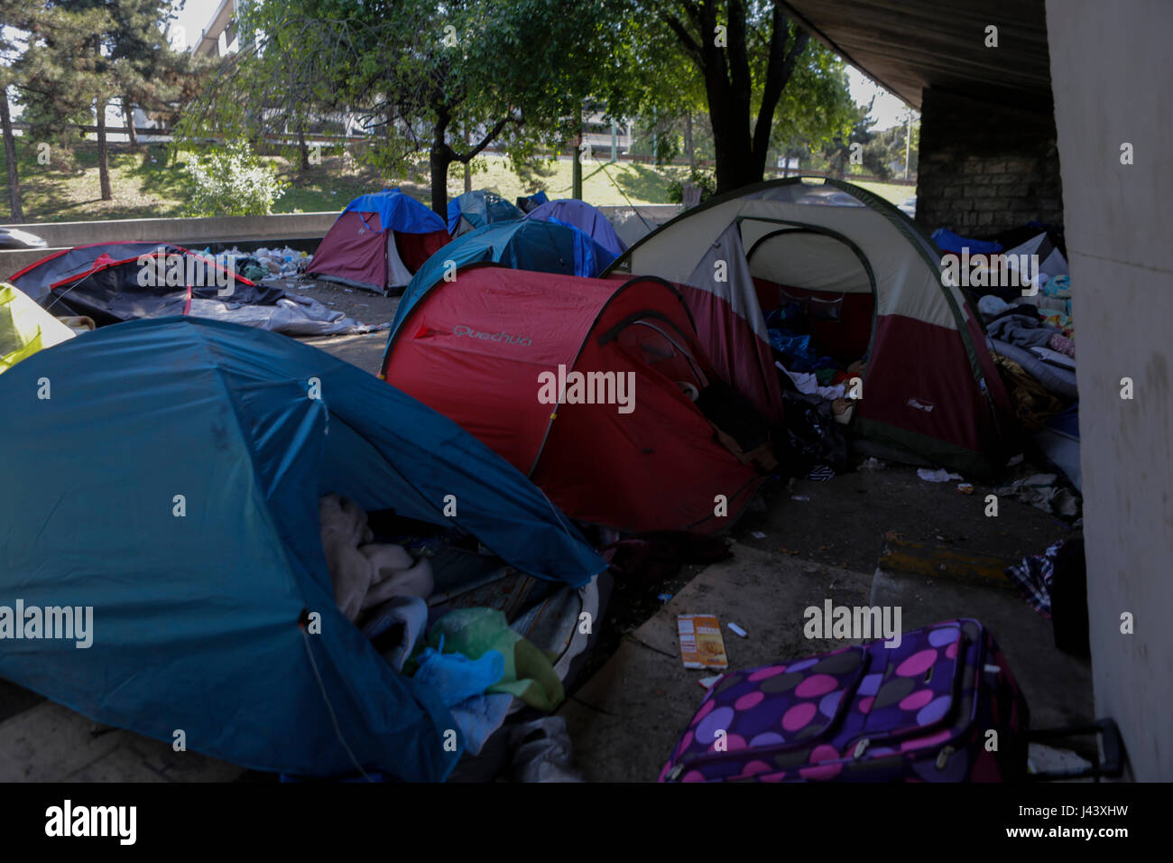 Paris, France. 9th May 2017. The tents that are located under an overpass leading to ring road around Paris are abandoned after the eviction. City officials of Paris are cleaning the abandoned tents of the refugee camp that has spread around the reception centre. The camp was evicted earlier in the morning. Credit: Michael Debets/Alamy Live News Stock Photo