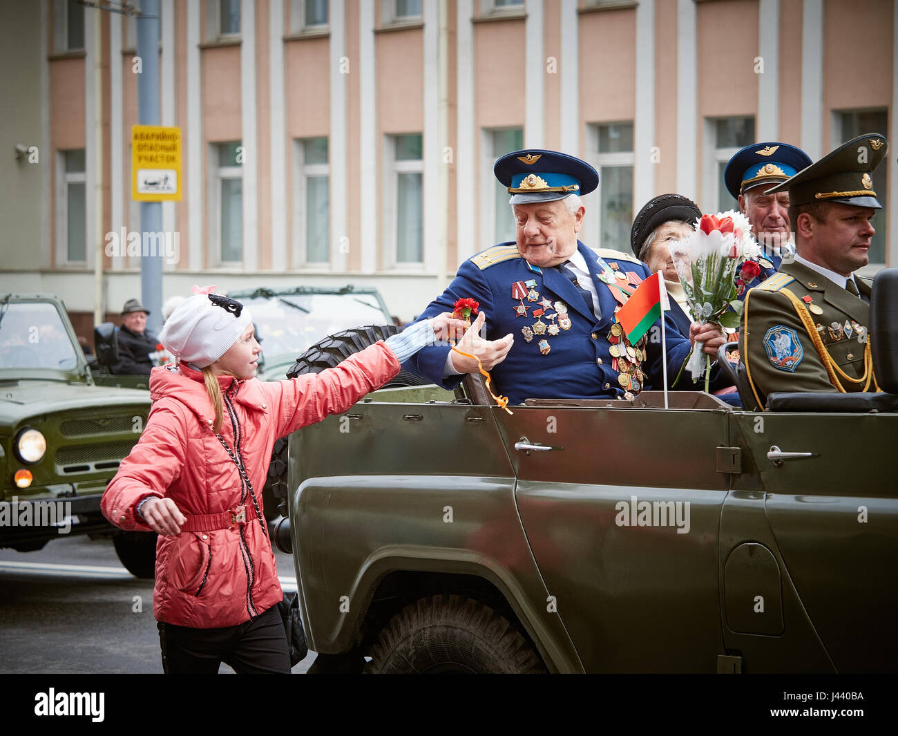 Vitebsk, Belarus. 9th May, 2017. The procession along the main street of the city. Participate in as the veterans of the great Patriotic war and young generation of Vitebsk. People give flowers to the elderly and lay wreaths at the monument 'Eternal Fire'. Credit: Alexey Vronsky/Alamy Live News Stock Photo