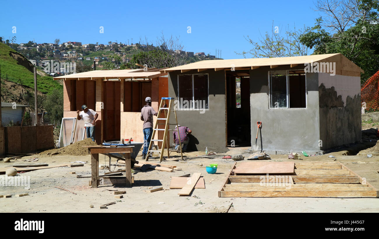 FILE - A file picture dated 08 March 2017 shows Haitian migrants building a hut near Tijuana, Mexico. Thousands of Haitians were forced to remain in the mexican border city of Tijuana due to tightened immigration norms in the US. Now several families are building a village there. It is called 'Pequeña Haití' (Little Haiti). Photo: Luis Alonso Pérez/dpa Stock Photo