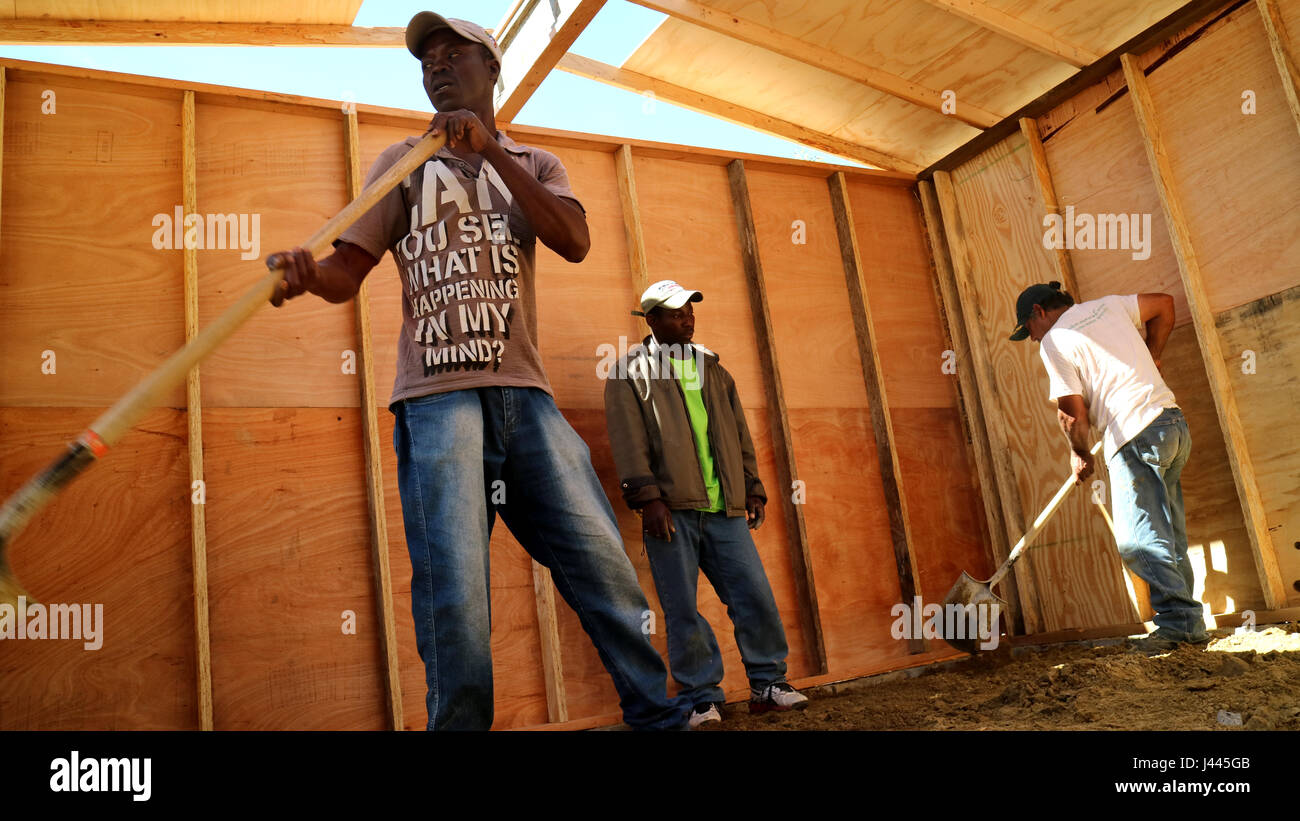 FILE - A file picture dated 08 March 2017 shows Haitian migrants building a hut near Tijuana, Mexico. Thousands of Haitians were forced to remain in the mexican border city of Tijuana due to tightened immigration norms in the US. Now several families are building a village there. It is called 'Pequeña Haití' (Little Haiti). Photo: Luis Alonso Pérez/dpa Stock Photo