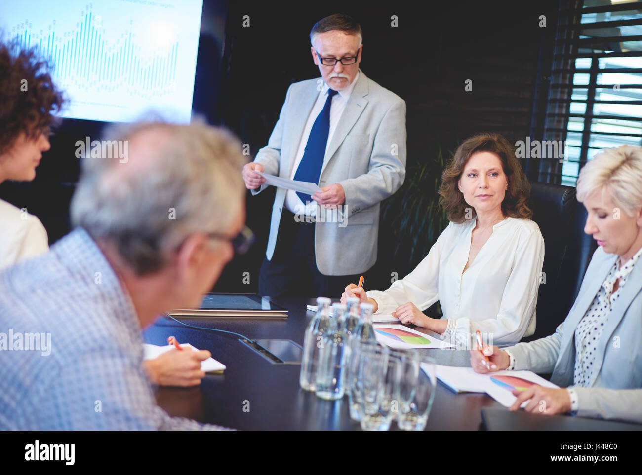 Businessman guiding in conference room Stock Photo