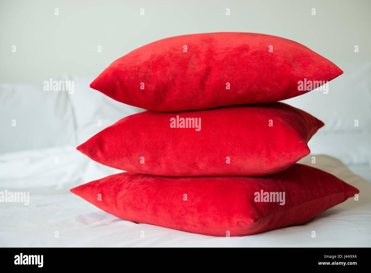 Red pillows on a bed Stock Photo Alamy