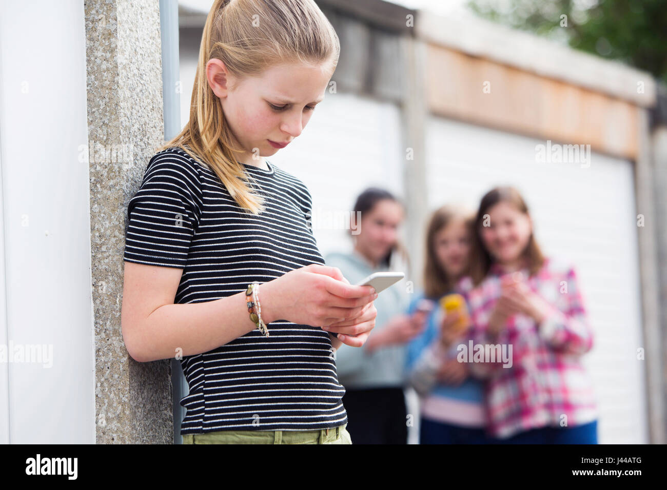 Pre Teen Girl Being Bullied By Text Message Stock Photo