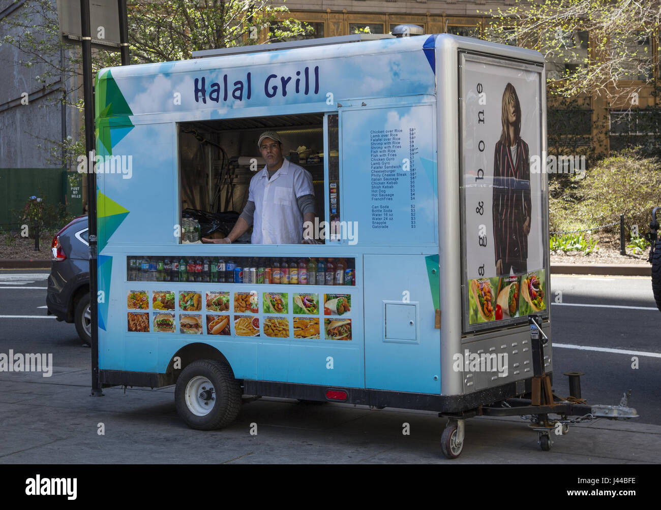 Halal food vendor on the street with his snazzy street kitchen in downtown Manhattan, NYC. Stock Photo