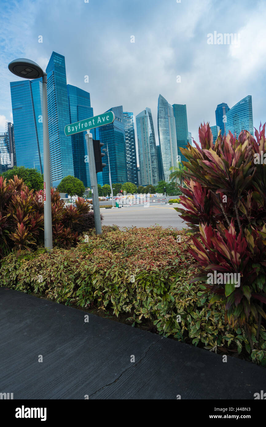 Modern skyscrapers over cloudy sky background Stock Photo - Alamy